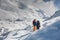 Trekkers crossing Gokyo glacier in Khumbu valley on a way to Eve