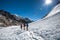 Trekkers crossing Gokyo glacier in Khumbu valley on a way to Eve