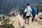 Trekkers hiking to Everest view hotel above Namche Bazaar