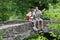 Trekkers relaxing on the stone bridge