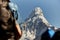 Trekkers walking on Everest trail while seeing mount Ama Dablam.