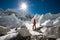 Trekkes is posing at camera in front of huge glacier falling fro