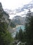 Trekking down to a mountain lake , Alps , Switzerland