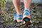 Trekking on the rocky road, foot close up