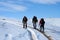 Trekking on snowy path on a sunny winter day