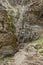 Trekking on a winding path through Imbros gorge near Chora Sfakion, island of Crete