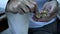 Trembling hand of pensioner counting cent coins, victim of financial crisis