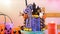 On trend Halloween candyland novelty drip cake in colourful party setting.