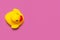 Trend Inflatable Children toy for swimming. Inflatable mini yellow chicken or duckling on pink background, pool float party. Flat