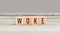 Trend Word Woke on wood cubes