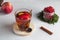 Trending photo of autumn or winter hot tea with cinnamon, lemon, Apple, berries and spices in a transparent Cup