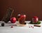 Trending photo of autumn or winter hot tea with spices, berries, apples. Autumn mood. Copy space