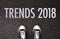 Trends 2018 wording on road with shoes.