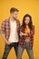 Trendsetters. Youth lead way in fashion ideas. Hipster couple students. Fashionable students couple yellow background