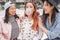 Trendy asian girls having fun together outdoor - Young women friends playing with bubble gum - Trends, youth, millennial