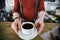 Trendy Barista Handing Cup of Black Coffee in Bar