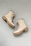 Trendy beige boots. fashion shoes still life