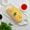 Trendy breakfast with quesadilla and eggs, trending food with omelet, cheese