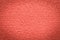 Trendy coral pink surface for background and wallpaper with dark vignetting gradient