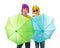 Trendy couple with sunglasses and wigs protected by umbrellas