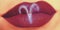 Trendy Creative lip makeup. Closeup Shiny glossy lips with Aries