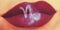 Trendy Creative lip makeup. Closeup Shiny glossy lips with Capri