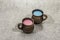 Trendy drink blue and pink latte. Lavender or spirulina and rose, beetroot or raspberry coffee. Stone concrete background