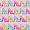 Trendy fashion pattern made of many elegant sandals with high heels on a pink background