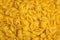 Trendy flat view closeup yellow macaroni. Conchiglie. Top view, flat lay. Nature concept. Texture background, pattern. Restaurant
