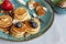 Trendy food during coronavirus Covid-19 lockdown quarantine - tiny pancakes. Poffertjes, Little Dutch pancakes. Breakfast for kids