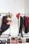 Trendy Footwear And Hats With Accessories On Clothes Rail