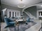 Trendy Fusion style living room interior with gray walls and blue upholstered furniture