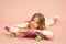 Trendy girl. Girl likes to ride skateboard. Active lifestyle. Girl having fun with penny board pink background. Kid