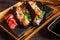 Trendy Hybrid Food Sushi Tacos with salmon, rice and edamame beans