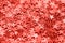 Trendy living coral star shaped festive confetti background