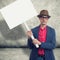 Trendy man holding protest sign