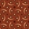 Trendy ornamental seamless pattern with circle and twirl elements of brown shades