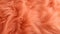 Trendy peach fur texture closeup. Abstract apricot wool structure background