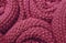 Trendy Red Pear color woolen knitted fabric close-up, texture, background