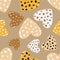 Trendy seamless pattern of leopard hearts on brown background.