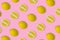 Trendy summer pattern with yellow lemon slice on bright pink background