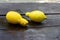 Trendy Ugly fruits. Strange shape lemons on wooden table outdoor.