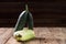 Trendy ugly organic squash and cucumber on dark natural blurred background. Copy space