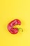 Trendy Ugly red chilli peppers on yellow background, minimal nature style, pop-art, creative food concept