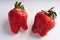 Trendy ugly strawberries on a light background