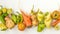 Trendy Ugly Vegetables: potatoes, carrots, cucumber, peppers and tomatoes on white background, ugly food concept