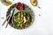Trendy vegetarian, vegan winter salad with quinoa, spinach, avocado, grapefruit, pomegranate, nuts and microgreens. Healthy