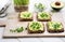 Trendy wholegrain toasts with avocado and microgreen