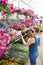 Trendy woman selecting nursery plants