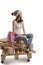 Trendy woman sitting on wooden pallets